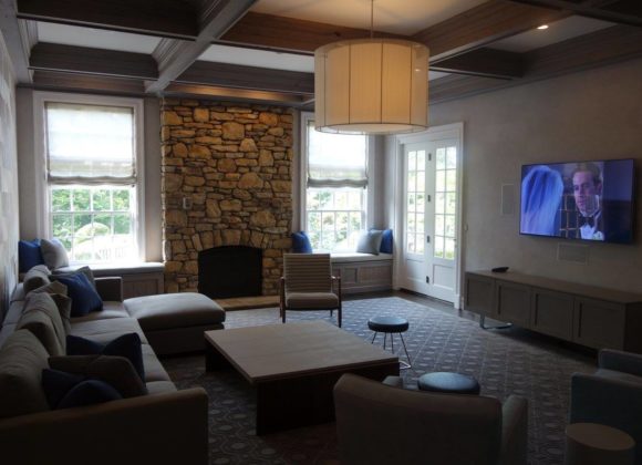 Home Automation in a dimly lit living room with a tv on in Franklin Lakes 