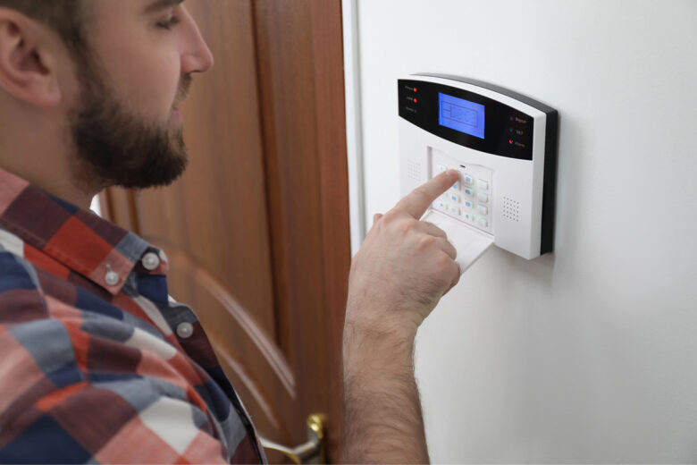 man using Home Automation, Smart Home Thermostat, and Lighting Controls in Livingston, NJ