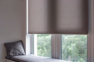 Window seat with an automatic roller shade and motorized shades in Franklin Lakes