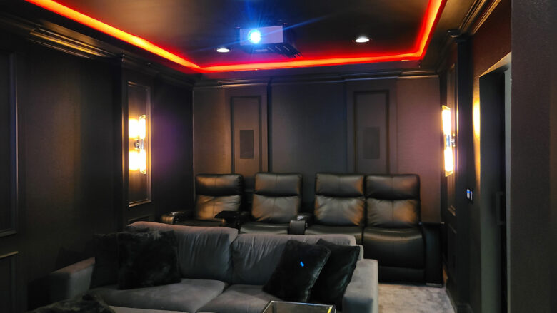 Dedicated home theater with leather recliners and LED cove lighting for a home theater installation in Short Hills