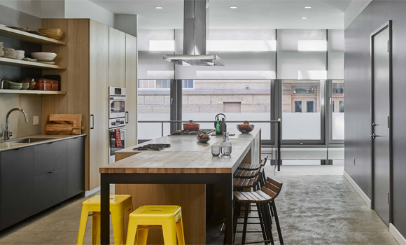Modern kitchen with automated Lutron shades and lighting controls in Demarest