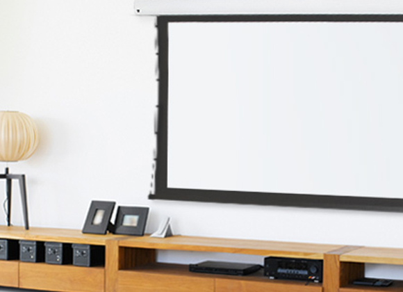 Wall-mounted projection screen with an AV console for a home theater installation in Mendham