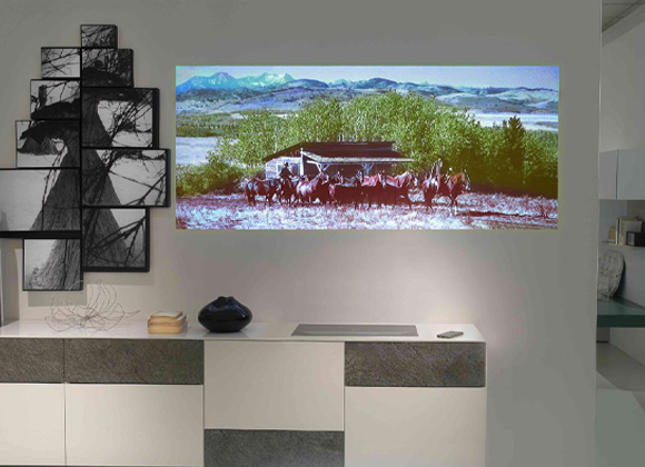 Widescreen display showing scenery above a console for a home video wall in New City