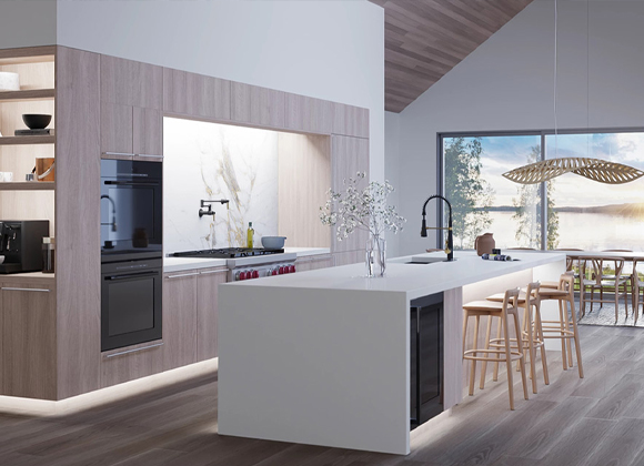Modern kitchen with an island and LED accent lighting for smart home lighting in Edgewater