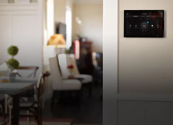 Wall-mounted touchscreen thermostat for a smart home thermostat in Englewood Cliffs
