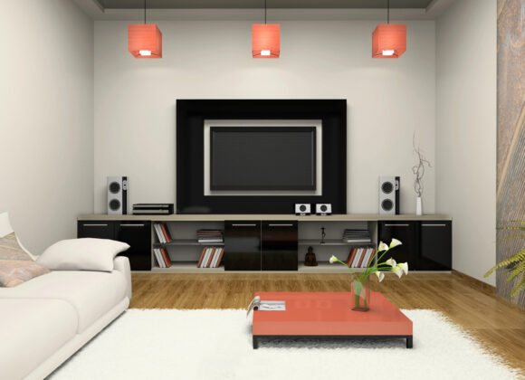 Home theater installation with a media wall and tower speakers in Mahwah