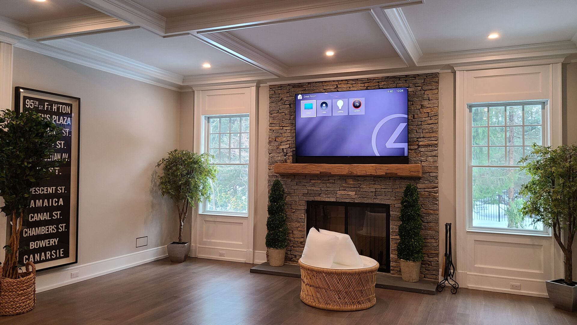 Living room with a Control4 Systems home automation screen on a stone fireplace in Tenafly