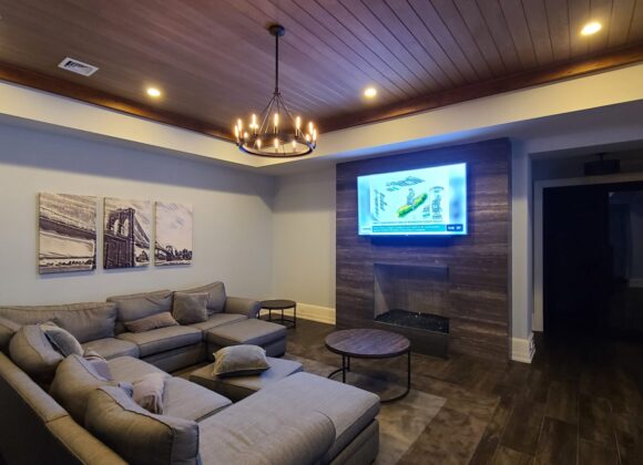 Smart home automation in a media room with a wall display in Hoboken