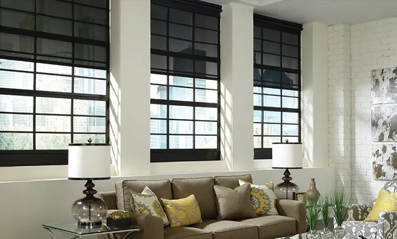 Lutron motorized shades on tall living room windows in Tribeca