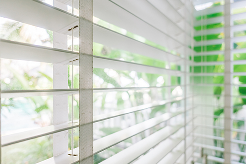 Motorized blinds on a bright window in Short Hills