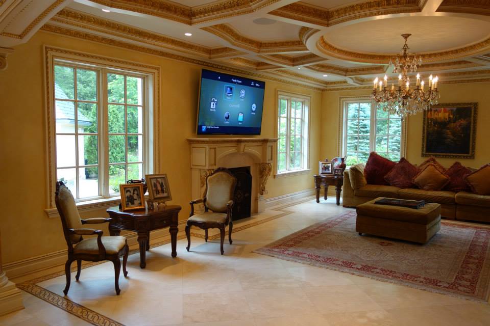 Formal living room with a wall-mounted touchscreen for whole home automation in Saddle River