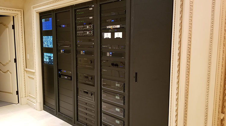 Large equipment rack of AV components for a custom audio installation in Alpine
