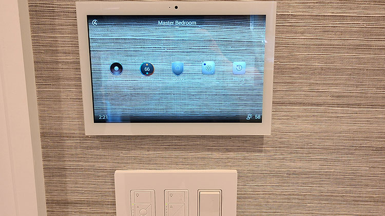 Wall-mounted touchscreen and Lutron lighting controls for smart home lighting in Demarest
