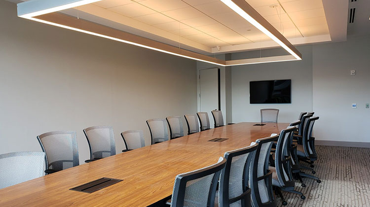 Corporate conference room with a wall-mounted display for a commercial A/V installation in Hoboken