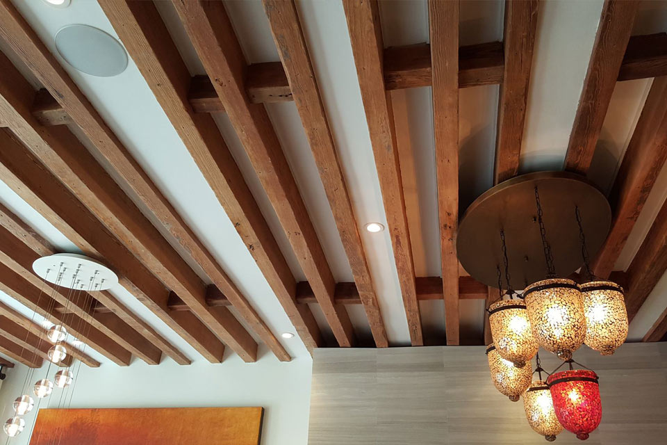 Beamed ceiling with in-ceiling speakers and accent lighting controls in Midtown Manhattan