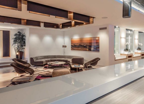 Luxury open-plan living space with lighting controls and whole home audio in Short Hills