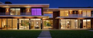 Modern luxury home at dusk with whole home automation and smart outdoor lighting in Greenwich