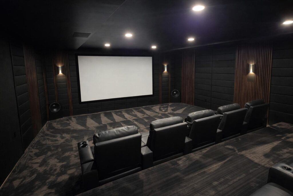 Home cinema design with a projection screen and surround speakers in Franklin Lakes