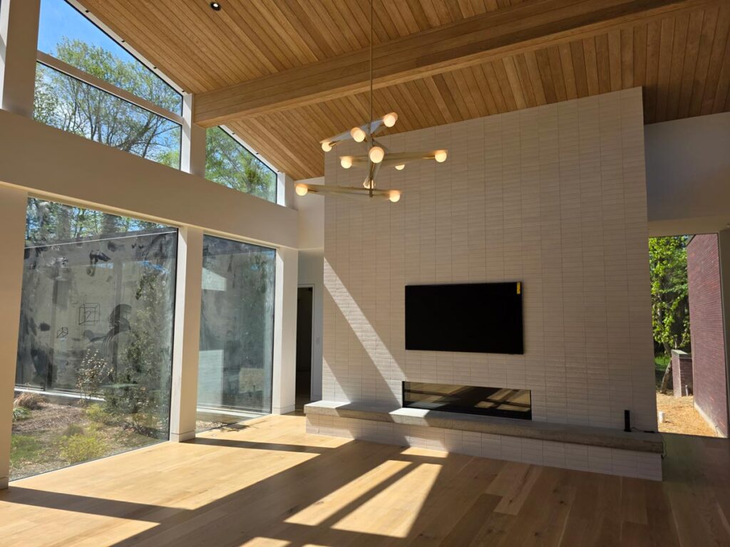 Modern residence great room with a home theater TV and whole home automation in Mahwah
